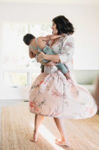 mom dancing with toddler son